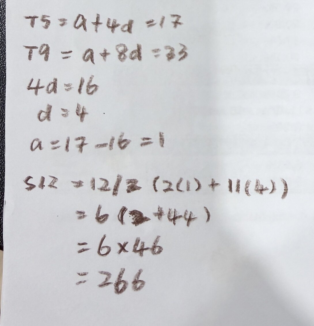 A handwritten answer to an arithmetic progression question. The working runs from T5 = a + 4d = 17 down to = 6 x 46, and the final line reads = 266.